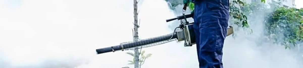 Pest control technician fogging an outdoor area for insect control in Nashville, TN