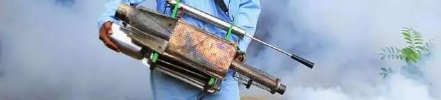 Fumigation technician using a fogger for deep pest treatment in Nashville, TN